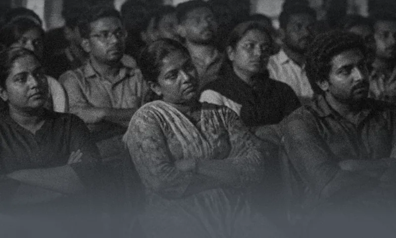 Rows of staff sitting in a meeting